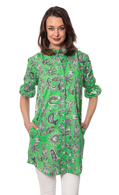 Green ruffle tunic with whimsical print by Dizzy-Lizzie, featuring a loose fit and stylish design for casual wear.