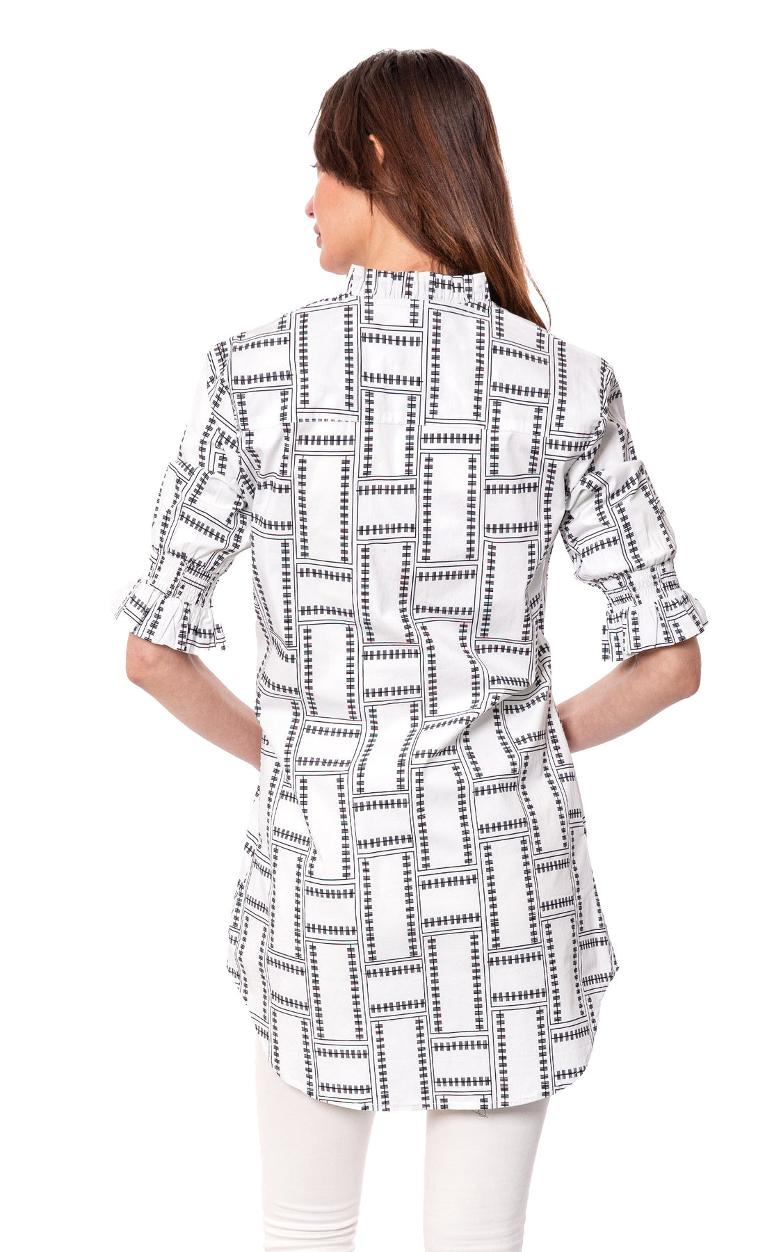 White geometric big shirt tunic by Dizzy-Lizzie featuring ruffle sleeves and a relaxed fit, perfect for casual wear.