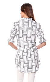 White geometric big shirt tunic by Dizzy-Lizzie featuring ruffle sleeves and a relaxed fit, perfect for casual wear.