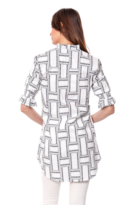 White Geo Big Shirt Tunic with ruffle sleeves by Dizzy-Lizzie displayed on a hanger.