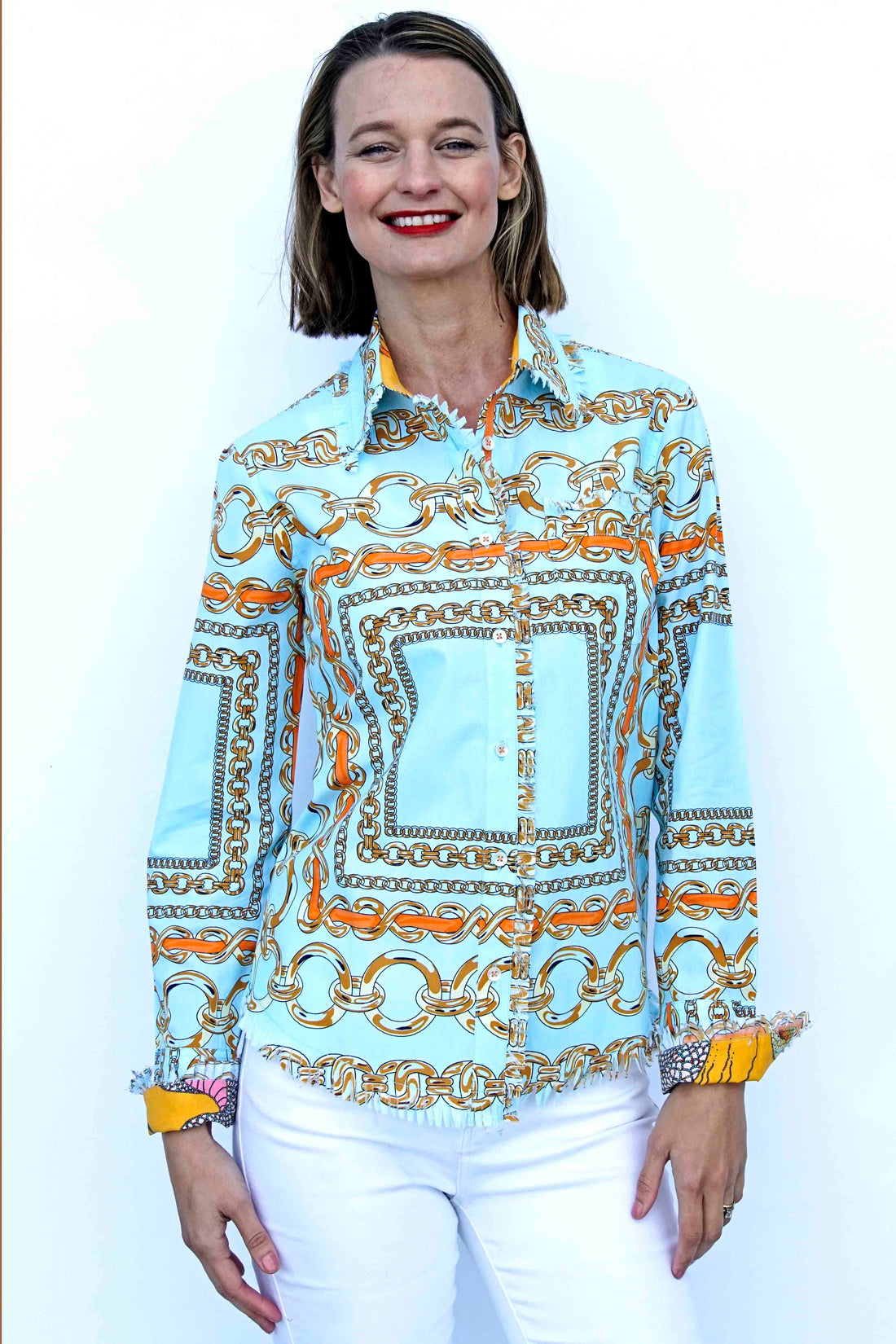 Dizzy-Lizzie Cape Cod Tunic in aqua ground fabric with orange link pattern, casual sleeveless top for women.