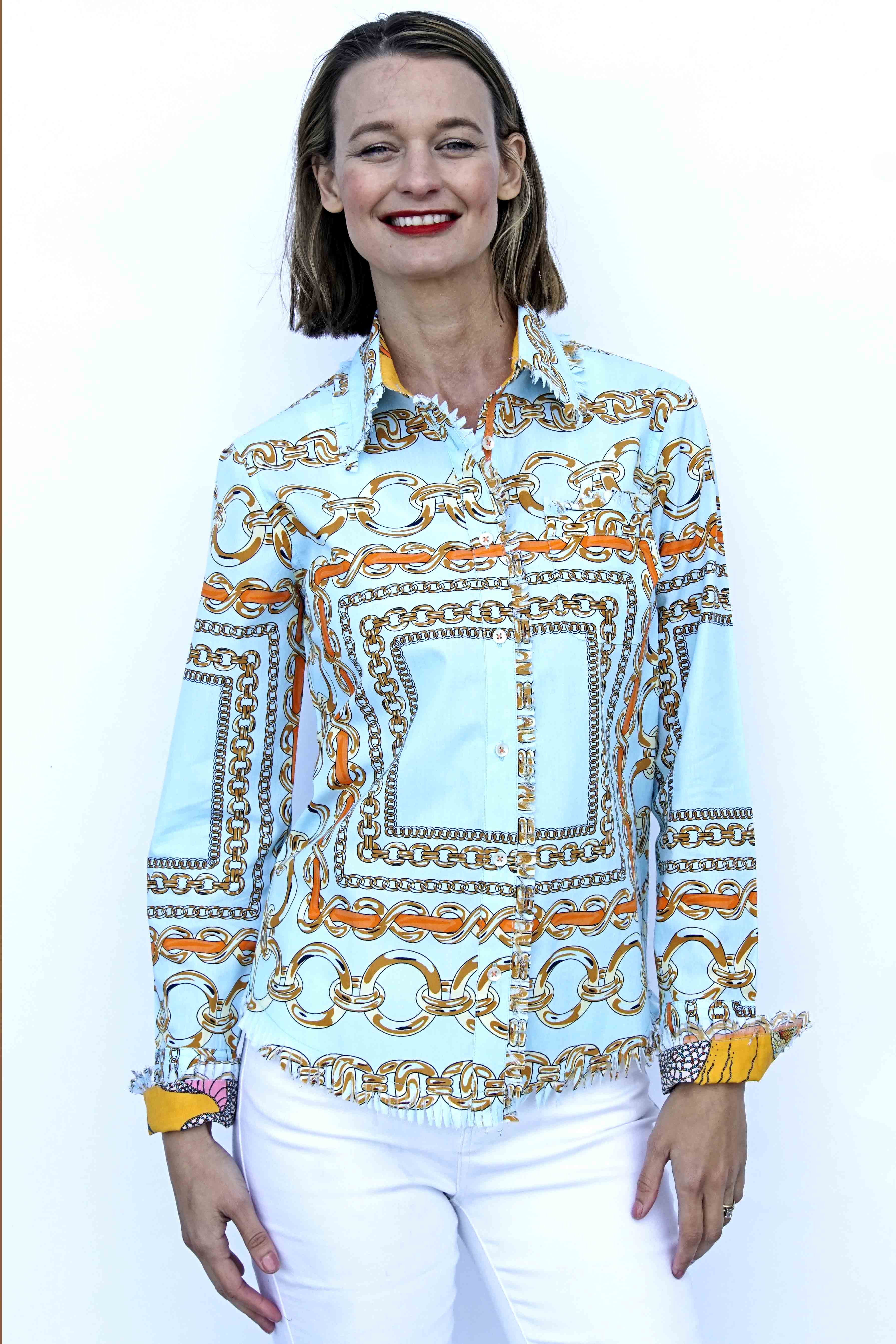 Dizzy-Lizzie Cape Cod Tunic in aqua ground fabric with orange link pattern, casual sleeveless top for women.