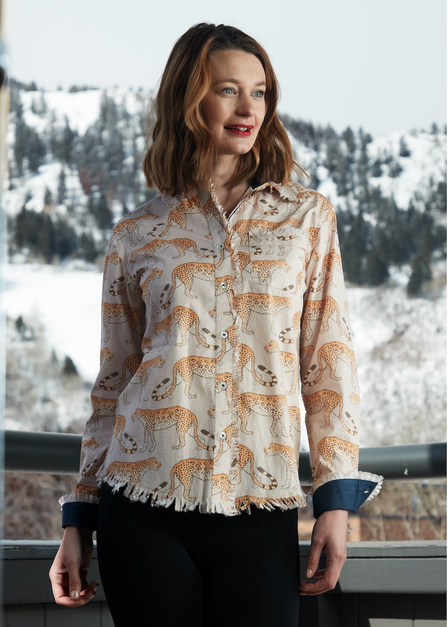Dizzy-Lizzie Cape Cod Leopard Tunic featuring a leopard print fabric, long sleeves, and a relaxed fit.