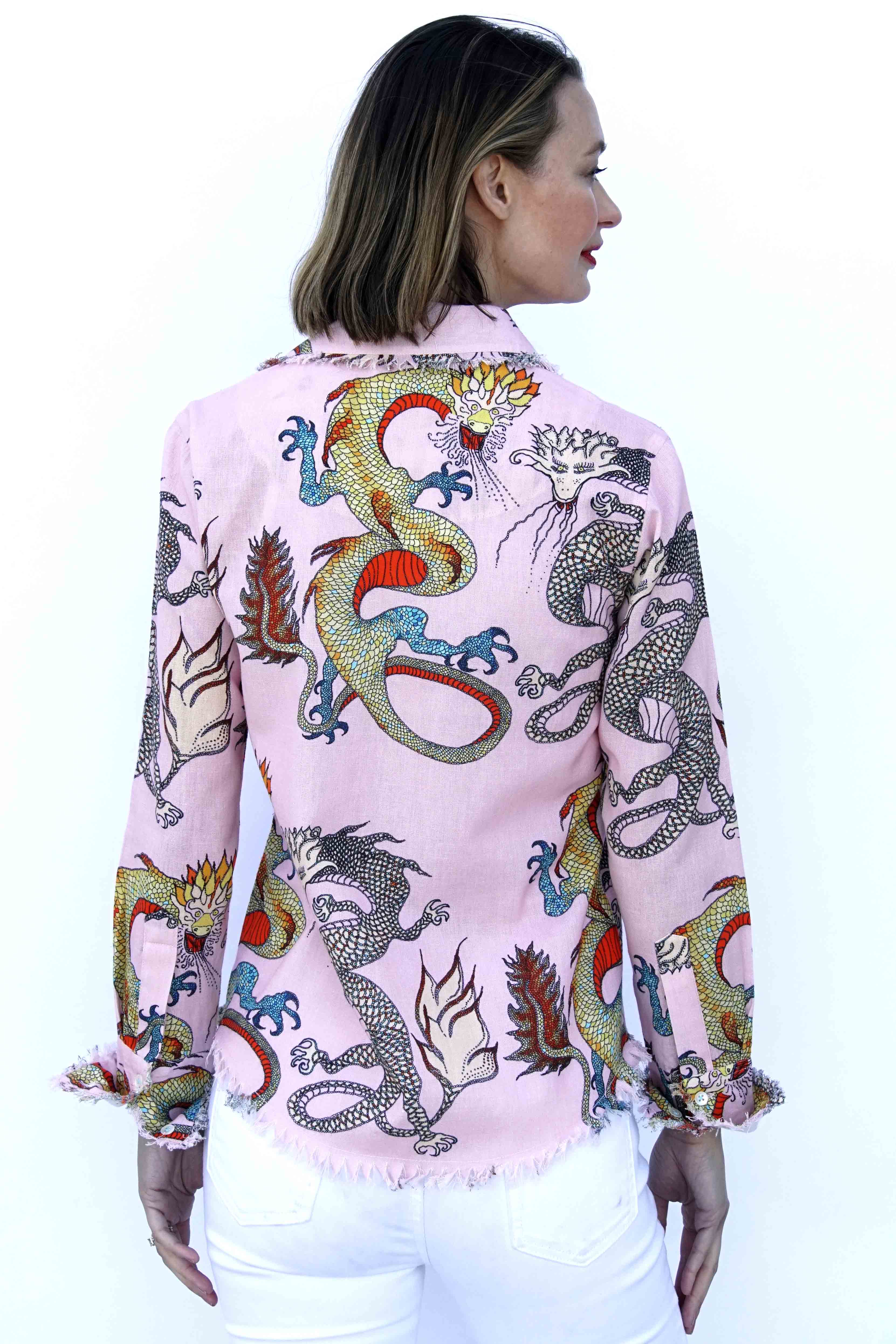 Pink ground dragons Cape Cod tunic by Dizzy-Lizzie featuring a loose fit and colorful dragon print on soft fabric.