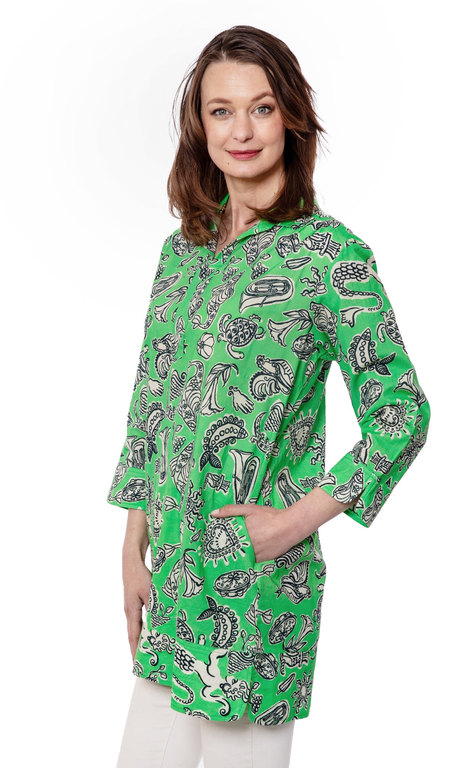 Dizzy-Lizzie Vail Tunic in green Whimsy print, featuring a relaxed fit and vibrant floral design, perfect for casual wear.