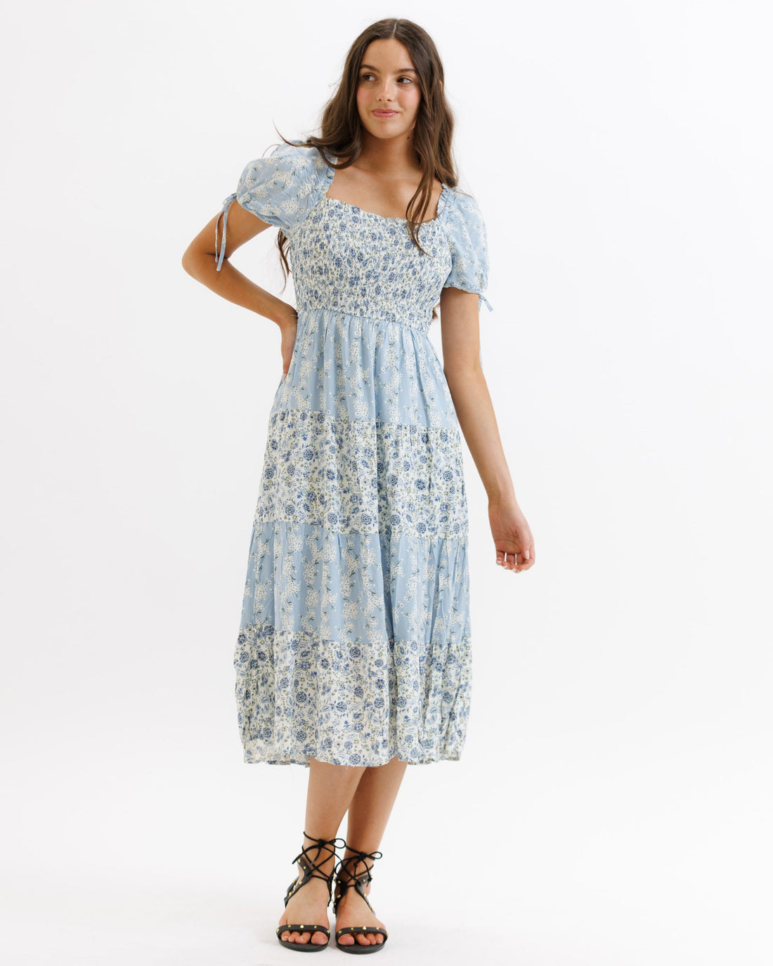 Downeast Fresh Bouquet dress featuring a vibrant floral pattern and flowing fabric, perfect for casual or summer wear.