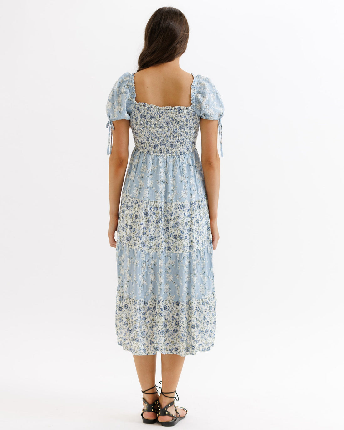 Downeast Fresh Bouquet Dress displayed on a hanger, showcasing a floral pattern and lightweight fabric perfect for spring and summer wear.