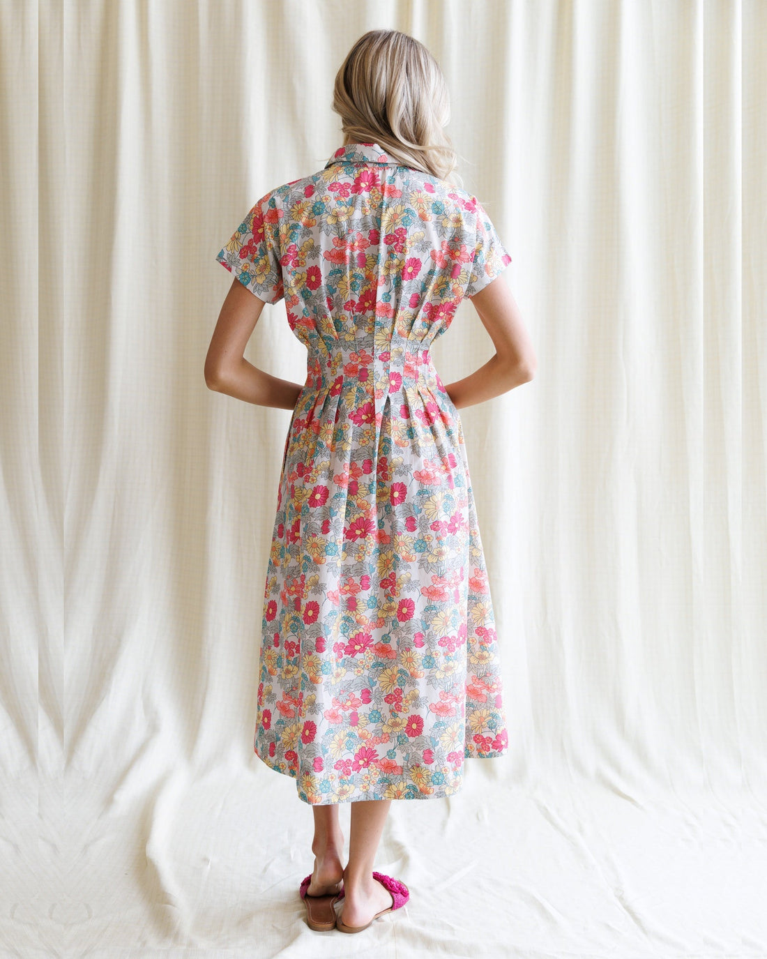 Downeast pleated shirtdress featuring a button-up front, long sleeves, and a flowy, knee-length design perfect for casual wear.