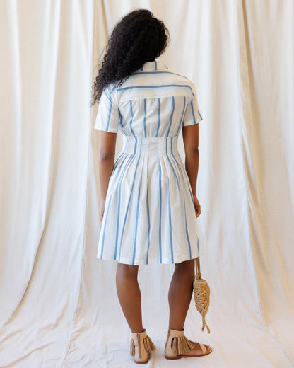 Downeast Seaside Stripe Dress featuring a flowy silhouette and nautical blue and white stripes, perfect for summer wear.
