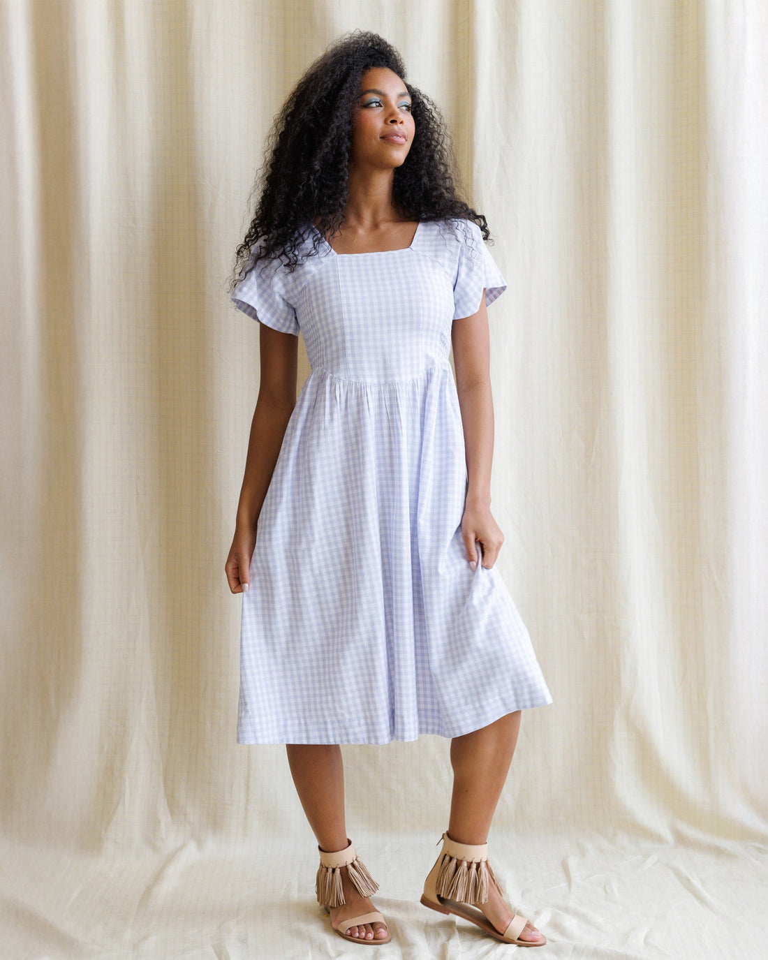 Downeast countryside dress with floral pattern, V-neckline, and short sleeves, displayed on a hanger.