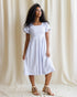 Downeast countryside dress with floral pattern, V-neckline, and short sleeves, displayed on a hanger.