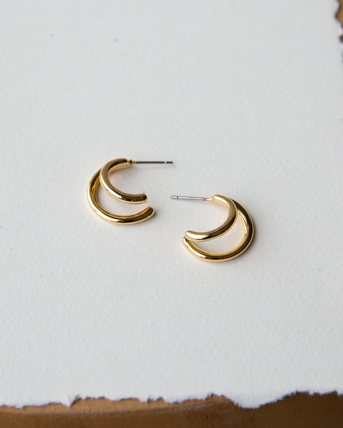 Downeast double hoop earrings with shiny silver finish, featuring two interconnected hoop designs on a white background.