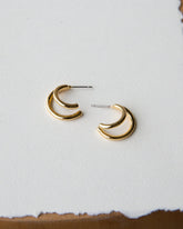 Downeast double hoop earrings with shiny silver finish, featuring two interconnected hoop designs on a white background.