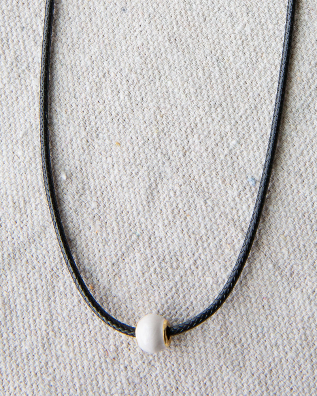 Downeast pearl and cord necklace featuring elegant white pearls on a stylish cord, perfect for casual or dressy occasions.