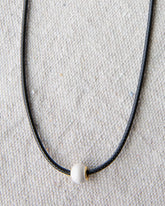 Downeast pearl and cord necklace featuring elegant white pearls on a stylish cord, perfect for casual or dressy occasions.