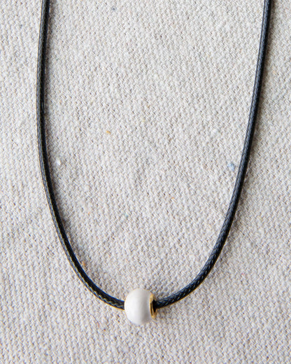 Downeast pearl and cord necklace featuring elegant white pearls on a stylish cord, perfect for casual or dressy occasions.
