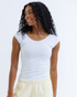 Downeast Essential Tee displayed on a hanger, showcasing its simple, comfortable design in a neutral color.