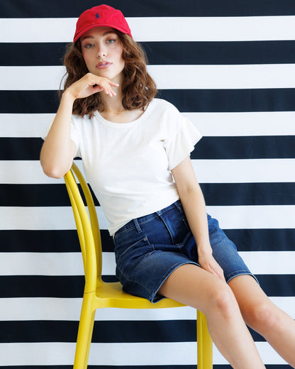 Downeast Charisma Tee, a stylish casual top in soft fabric, featuring a relaxed fit and classic design, displayed on a hanger.