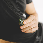 Conscious Items Dragon’s Heart Transformation Pendant necklace featuring a detailed dragon&
