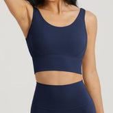 Blackout Barbell Omni Bra in navy color, showing the supportive, seamless design with adjustable straps and soft fabric.