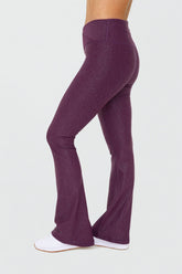 Black leather-look crossover flare leggings from Fitkitty Culture, stylish women&