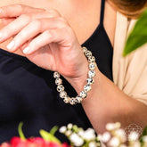 Dalmatian Jasper bracelet from Conscious Items featuring a string of polished black and white spotted gemstone beads.