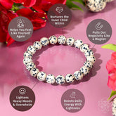 Dalmatian Jasper bracelet by Conscious Items featuring natural stone beads with distinctive black spots and earthy tones.
