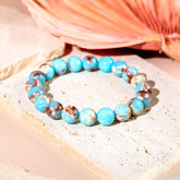 Aqua Terra Jasper bracelet from Conscious Items called Empath’s Shield, featuring round green and brown stone beads on a stretch cord.