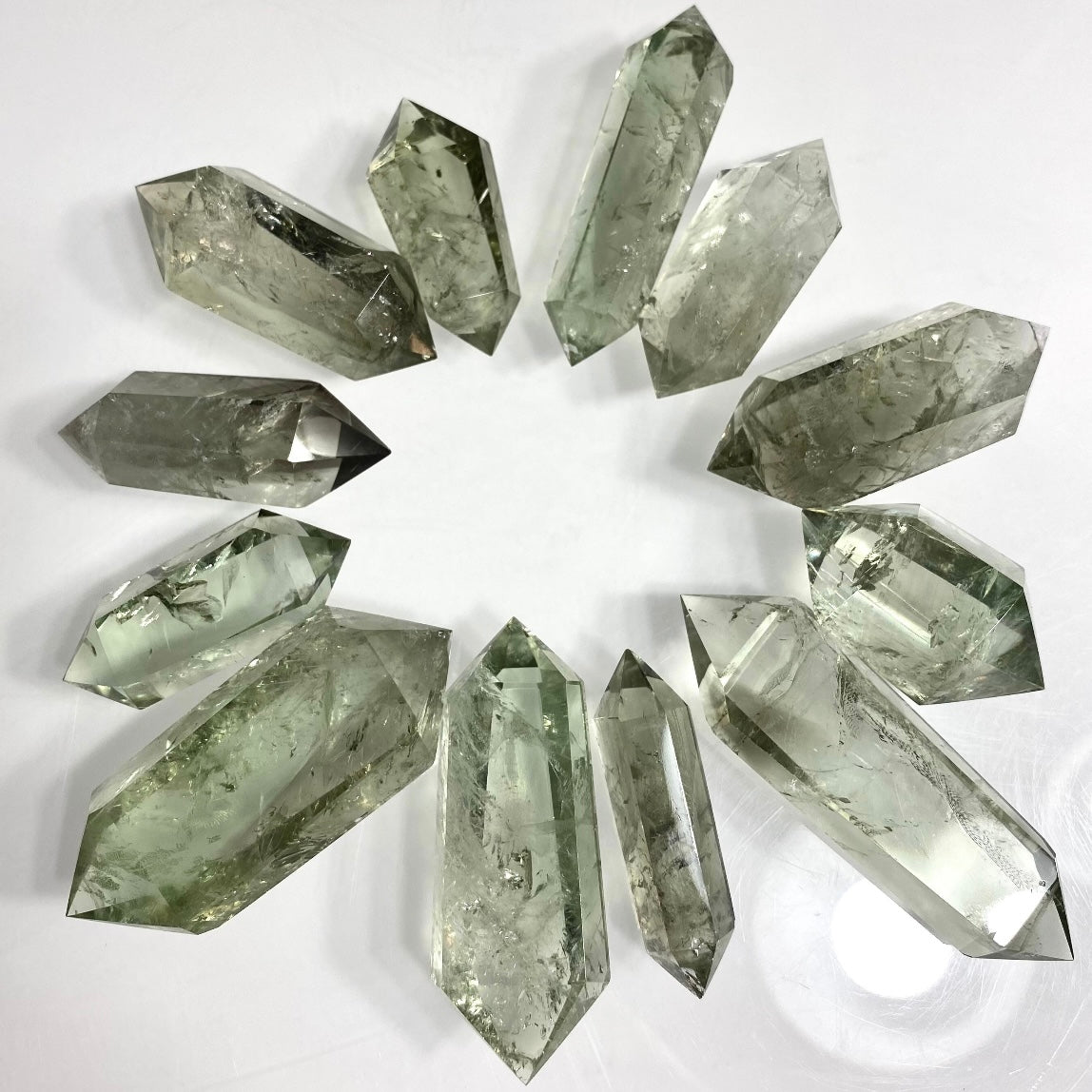 Prasiolite Green Amethyst double terminated crystal point from Evermore Everlasting, showcasing a polished, natural gemstone with pointed ends.