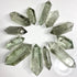 Prasiolite Green Amethyst double terminated crystal point from Evermore Everlasting, showcasing a polished, natural gemstone with pointed ends.