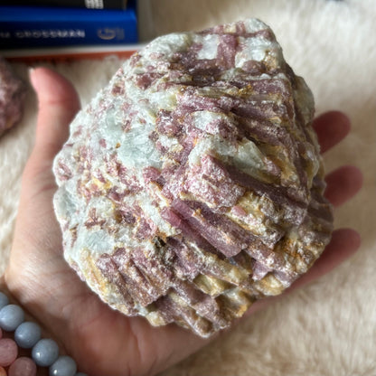 Raw pink tourmaline gemstone from Evermore Everlasting, showing its natural pink color and rough crystalline texture.
