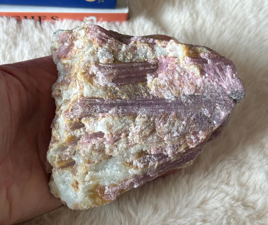 Raw pink tourmaline gemstone from Evermore Everlasting with natural, unpolished pink mineral crystal on a neutral background.