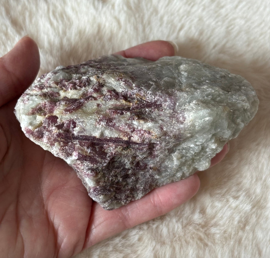 Raw pink tourmaline gemstone from Evermore Everlasting showing its natural pink hue and rough, unpolished mineral texture.
