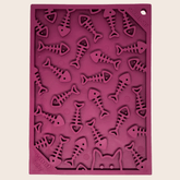 Maroon Farm To Pet lick mat with fishbone pattern for cats and small dogs, featuring textured surface for engaging pet play.