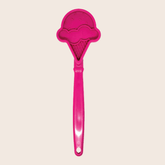 Close-up of Farm To Pet Lick Stick, an interactive pink ice cream-shaped dog training toy with textured surface for licking and play.