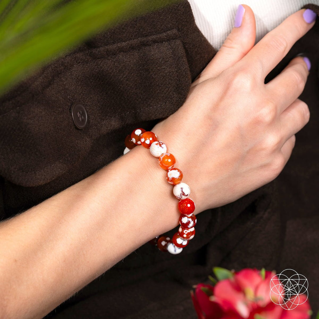 Feminine Force Carnelian Orca Agate bracelet by Conscious Items featuring orange carnelian and black and white orca agate beads.