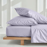 Luxury Australian sateen sheet set from Italic, featuring smooth, silky bed sheets in a cozy home bedroom setting.