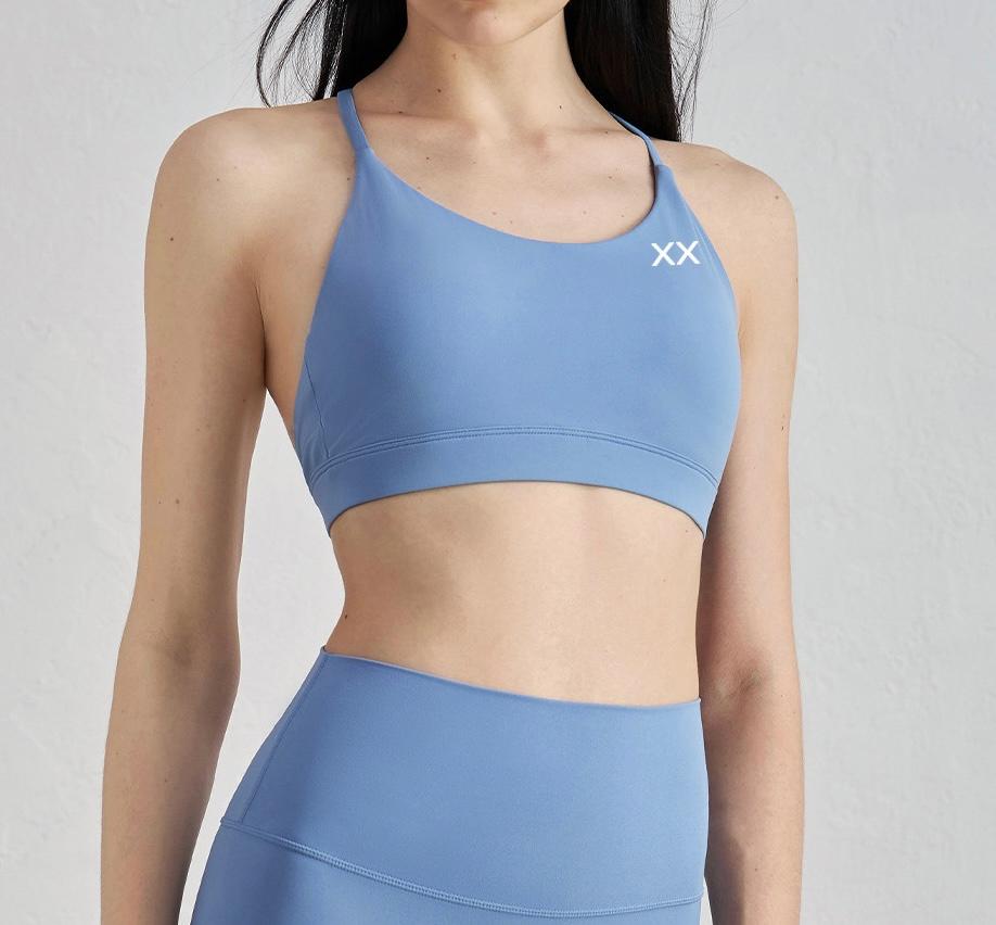 Blackout Barbell Aria Bra featuring sleek design and comfortable fit, shown in the image with adjustable straps and smooth fabric.