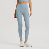 Blackout Barbell Omni Legging in Cloudy Blue, close-up of high-waisted athletic leggings with seamless design and stretchy fabric.