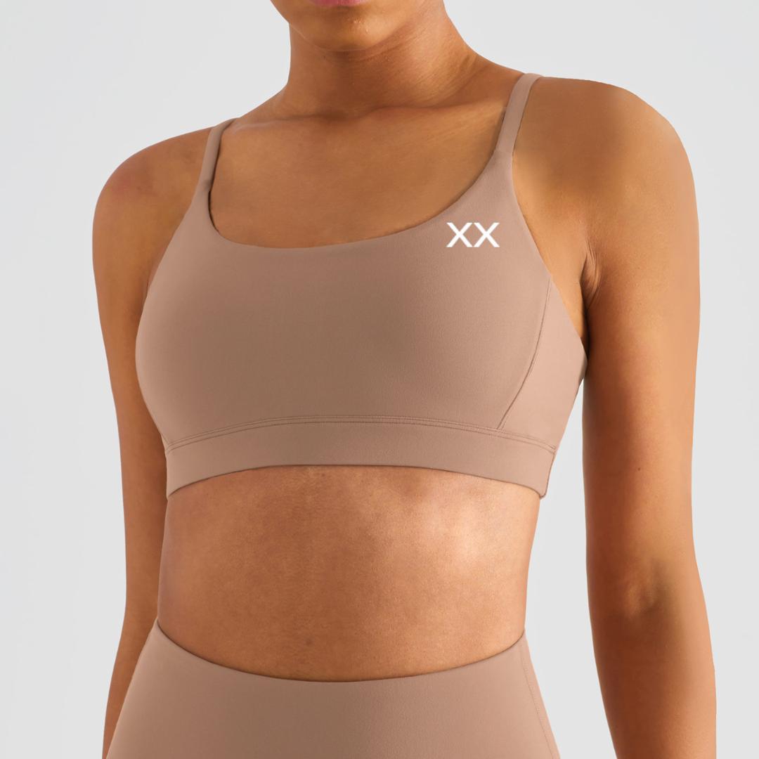 Black Echo Bra by BLACKOUT BARBELL in black fabric, featuring sleek design and comfortable fit for everyday wear.