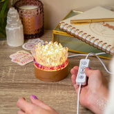 Find My Peace quartz and tourmaline night light from Conscious Items, featuring a blooming tranquility design with glowing crystals.
