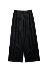 Black Leiseu track pants by findmenowthelabel, flat lay showing elastic waistband and relaxed fit for casual wear.