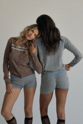 Findmenowthelabel cashmere wool stripe cardigan, cozy knitwear with colorful stripes, displayed on a neutral background.
