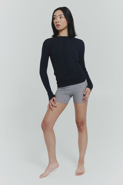 Navy ribbed knit cardigan from findmenowthelabel featuring a cozy, textured knitwear design and button-up front.