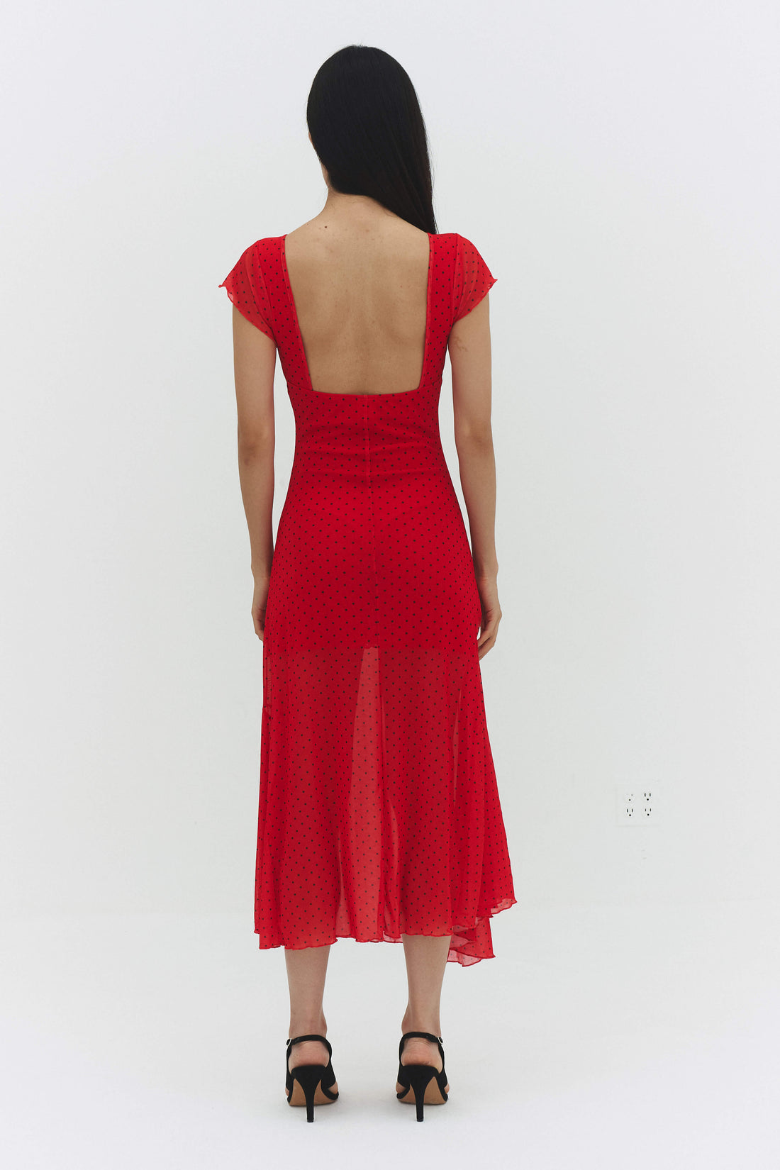 Findmenowthelabel Valentina red maxi dress, flowing fabric and elegant design, shown on a model.