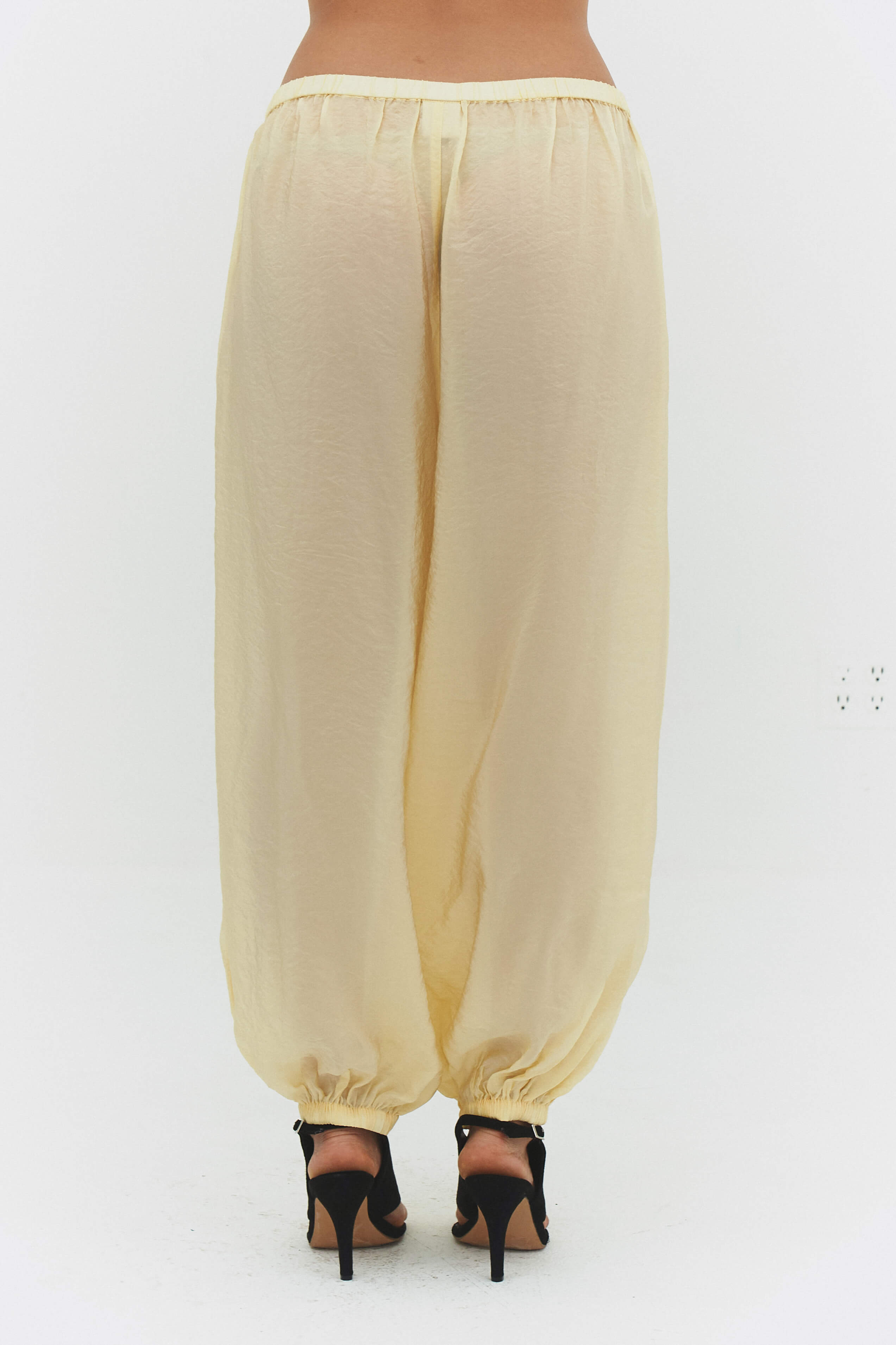 FindmeNowTheLabel ZORA voile pant in butter, lightweight flowy pants with a relaxed fit and soft fabric, shown in a natural pose.