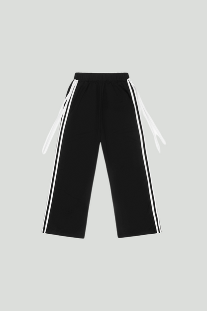 Black French Terry Bow Jogger pants by findmenowthelabel featuring a relaxed fit and elastic waistband.