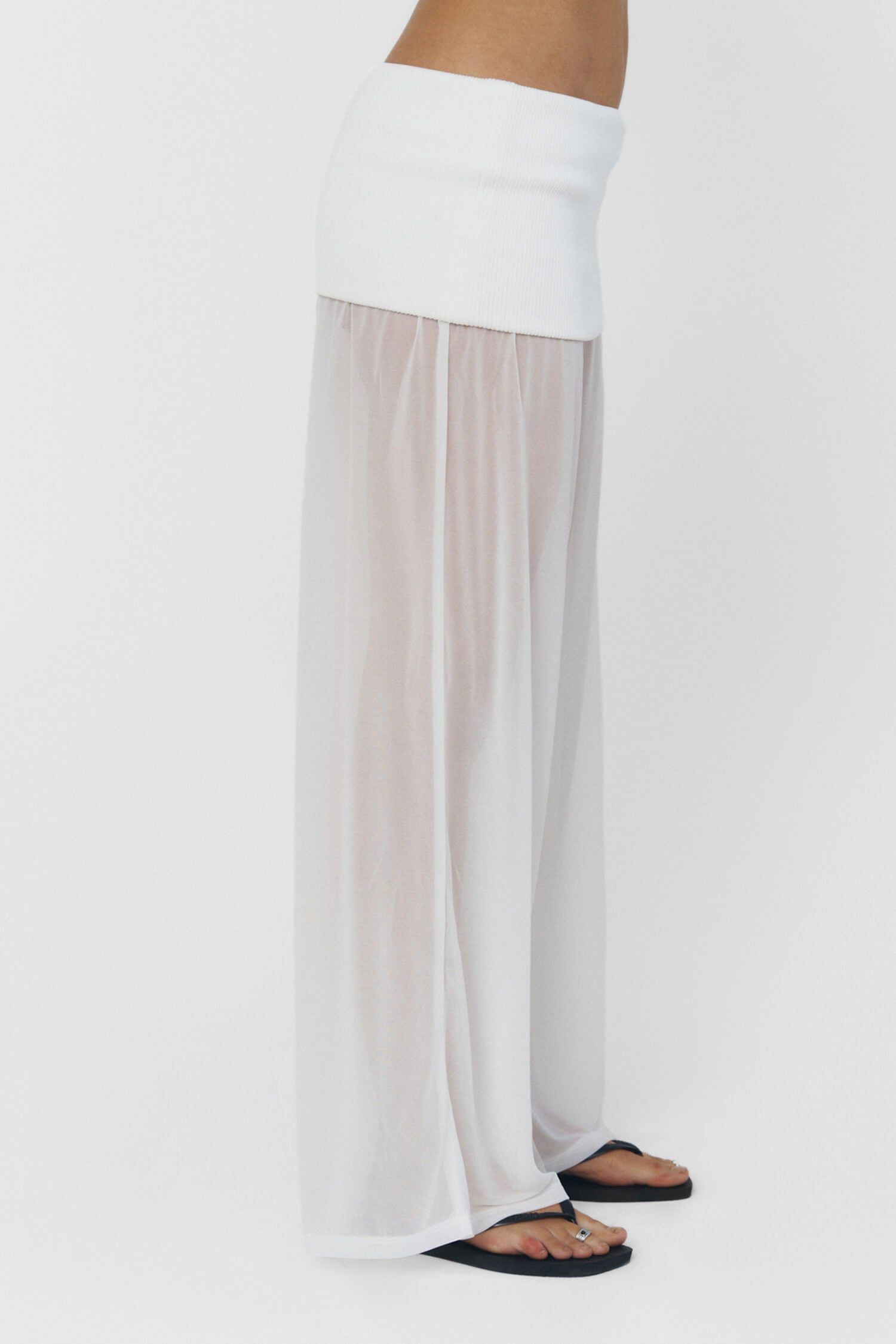 Findmenowthelabel RAEL white pants, stylish and comfortable, shown on model with a relaxed fit and clean design.