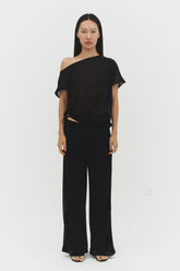 Black BRISA top by findmenowthelabel, showcasing a stylish sleeveless design with a fitted silhouette and minimal detailing.