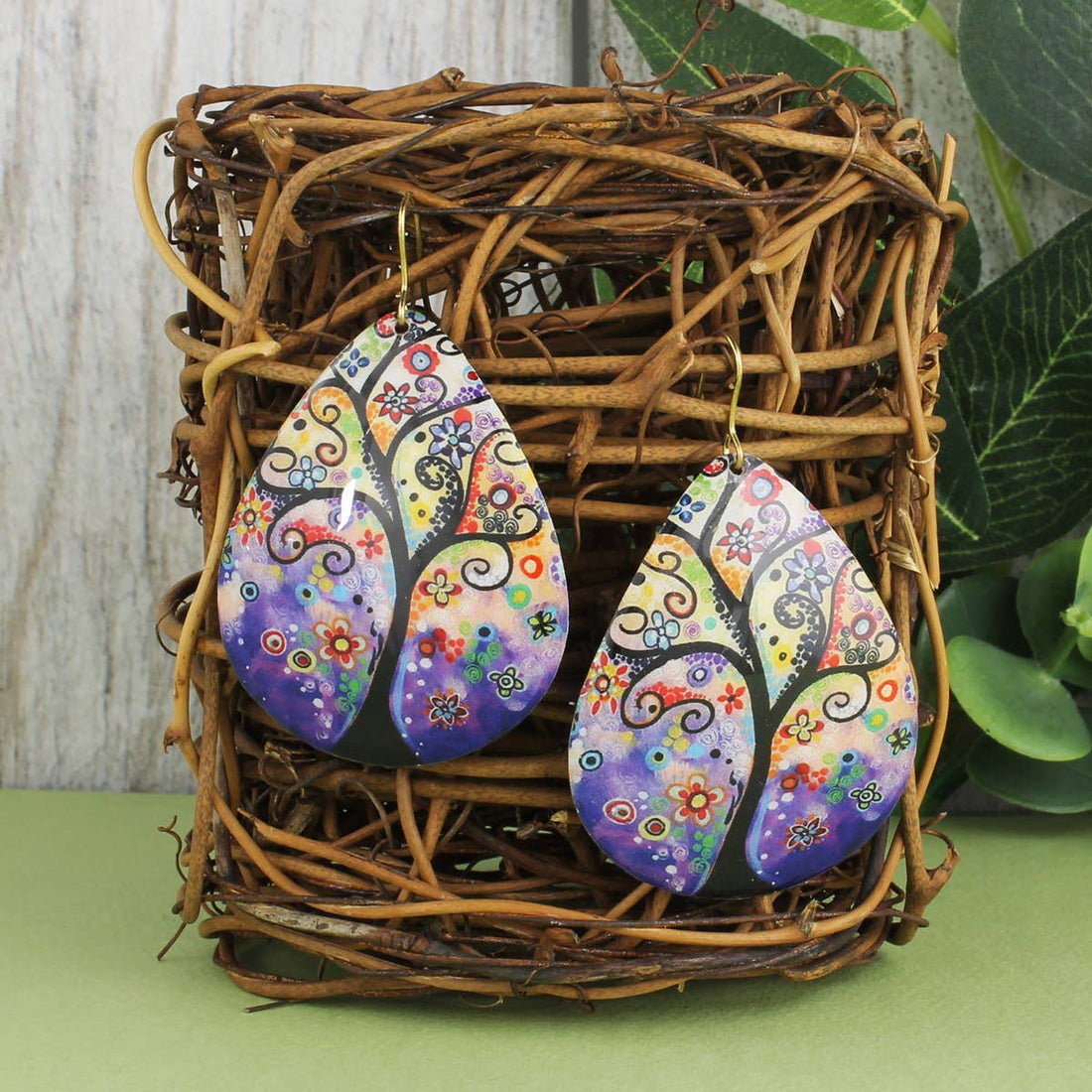 Whimsical Tree of Life teardrop earrings featuring intricate designs, perfect as stylish accessories for women.